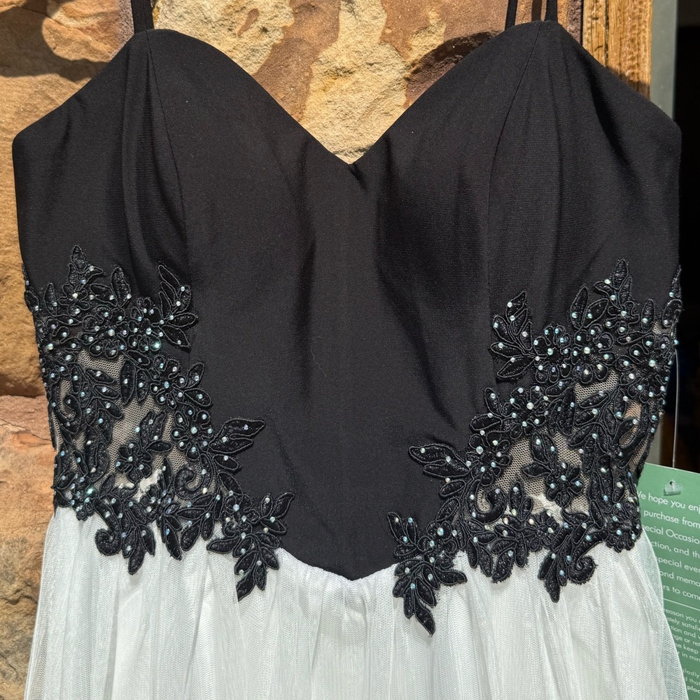 Elegant Black and White Dress with Beaded Details size 7